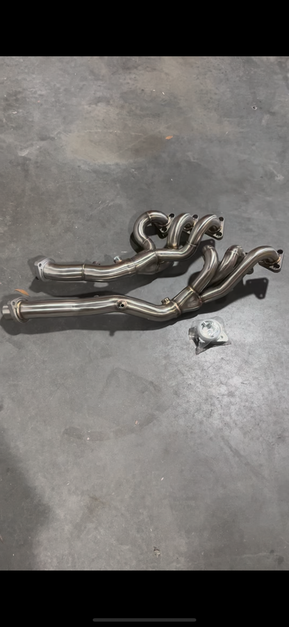 BMW E46 M3 S54 exhaust headers by JackSpania Racing, showcasing high-performance metal headers for 2001-2006 3 Series models.