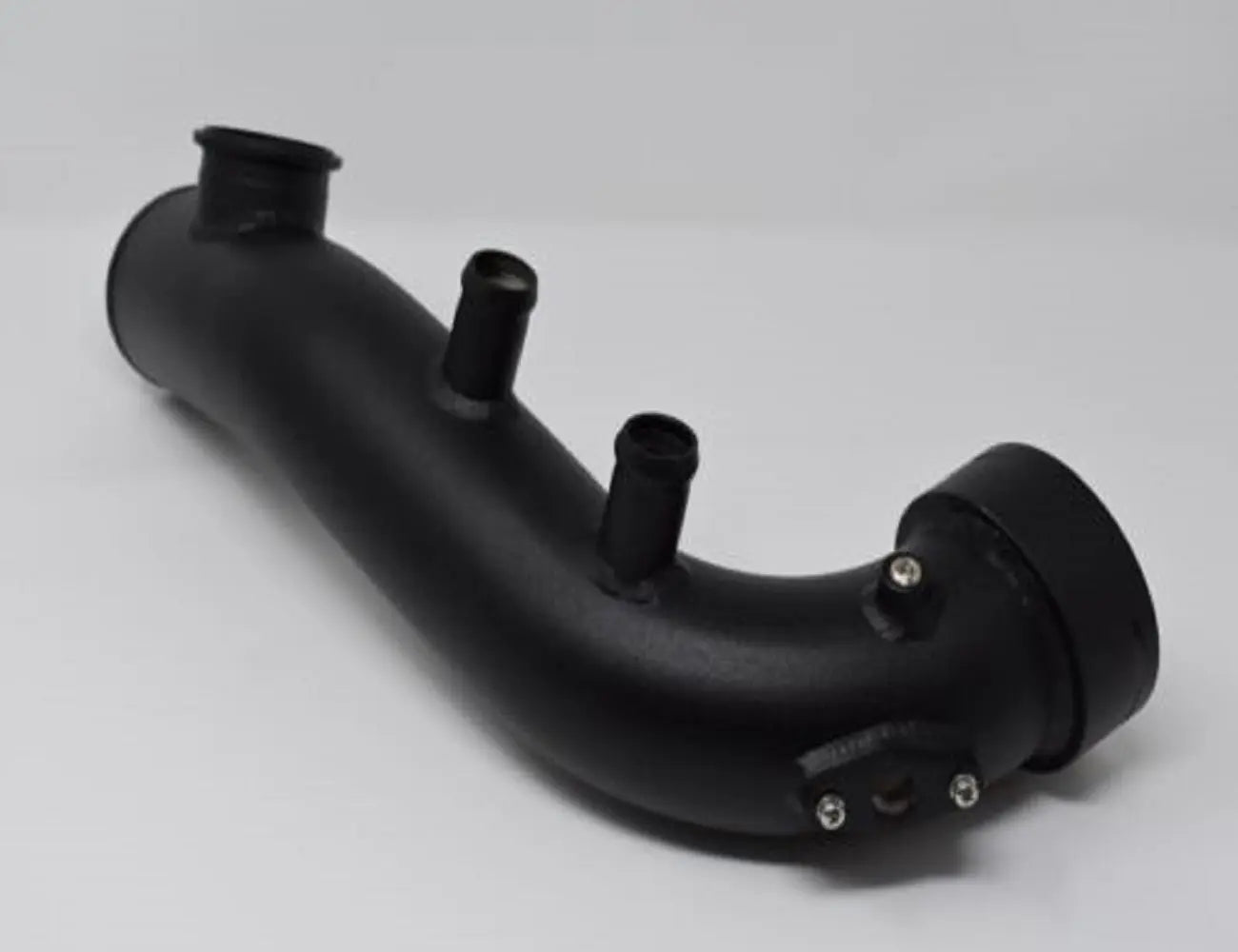 BMW N54 charge pipe kit with blow-off valve from Jack Spania Racing, installed in E90 335i engine with visible piping and fittings