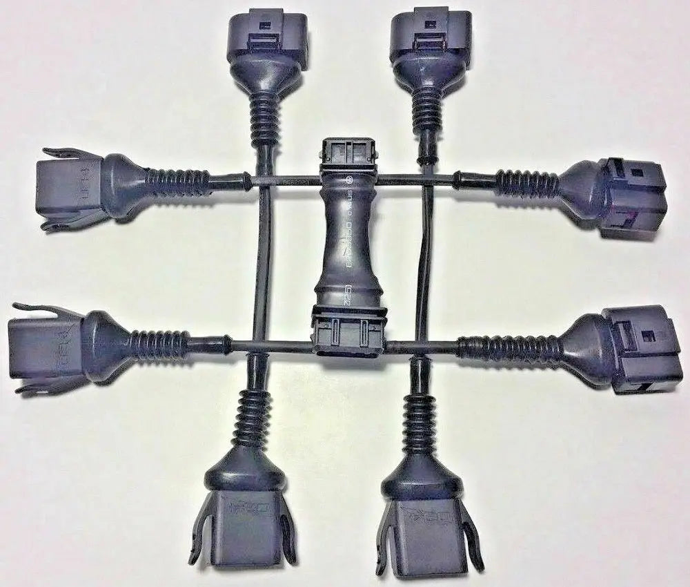 Audi 2.0T FSI coil conversion harness and ICM delete for B5 A4 97-99.5 1.8T engine, by Jack Spania Racing, close-up view of engine parts.