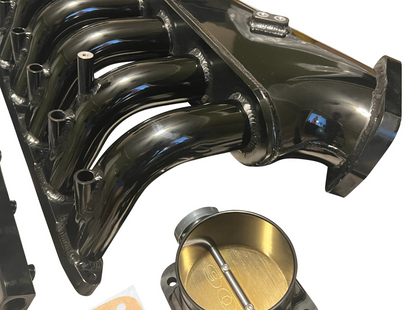 BMW E36 E46 M50 M52 M54 engine intake manifold and throttle body by Jack Spania Racing, showing metal engine parts and connectors.
