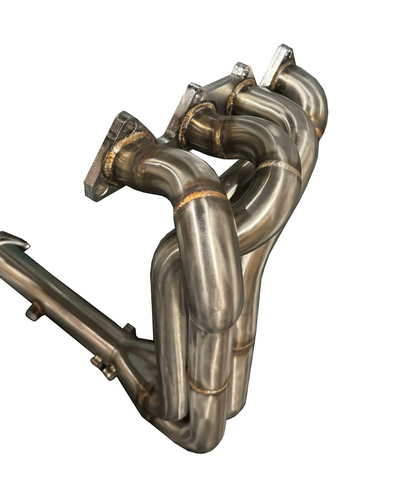 JackSpania Racing B Series 4-1 Narrow Header for B16, B18, B20 engines, shown from an angle highlighting the polished exhaust manifold.