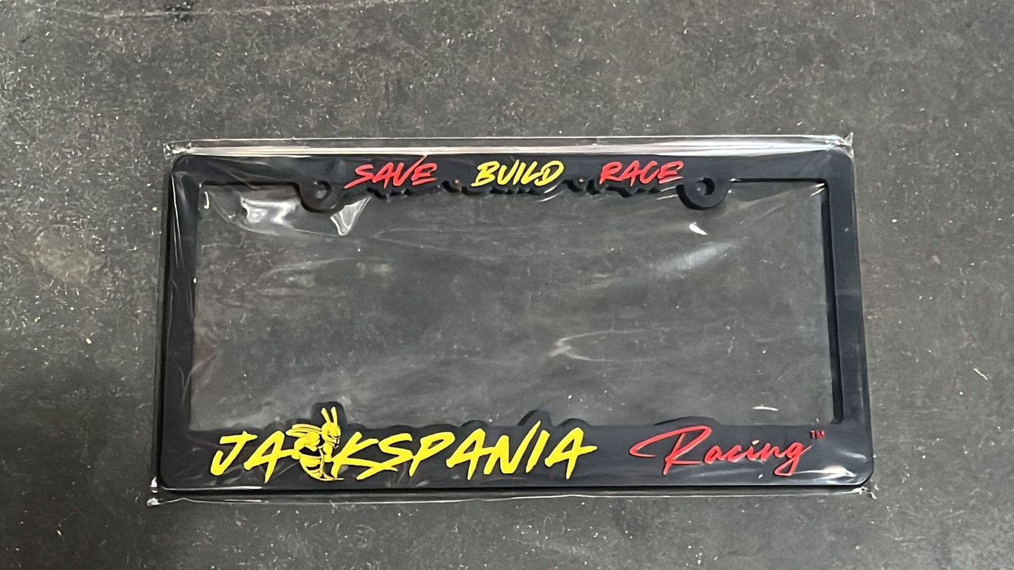 JackSpania Racing license plate cover with bold black and white design, featuring racing logo and sleek finish for vehicle decoration.