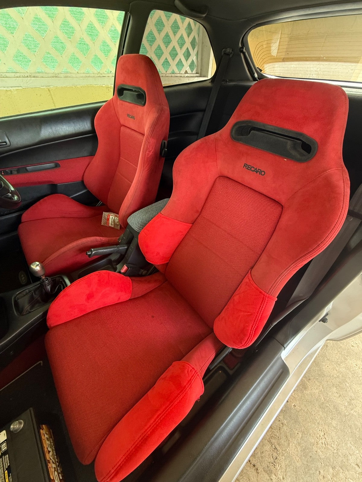 Two JackSpania Racing suede seat protectors for Recaro SR3 and SR4 semi-bucket seats, shown in a natural interior setting.