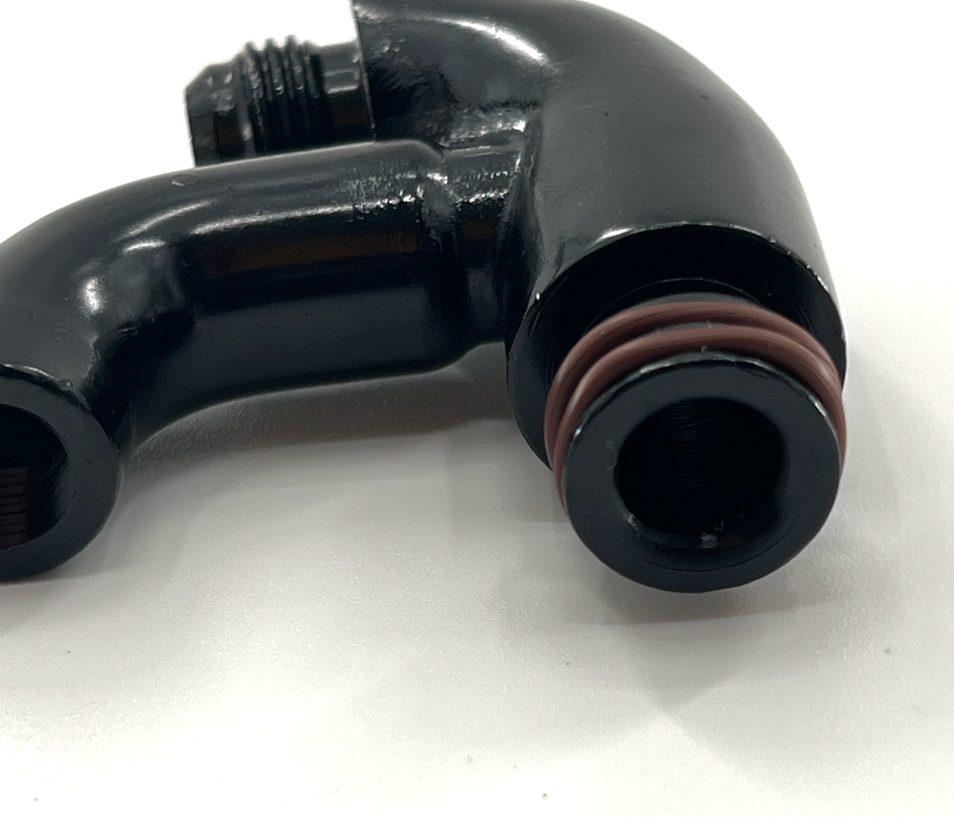 JackSpania Racing center mount fuel rail gauge holder with AN6 fitting for K Tuned K Series fuel rail, shown with fittings and mounting hardware.