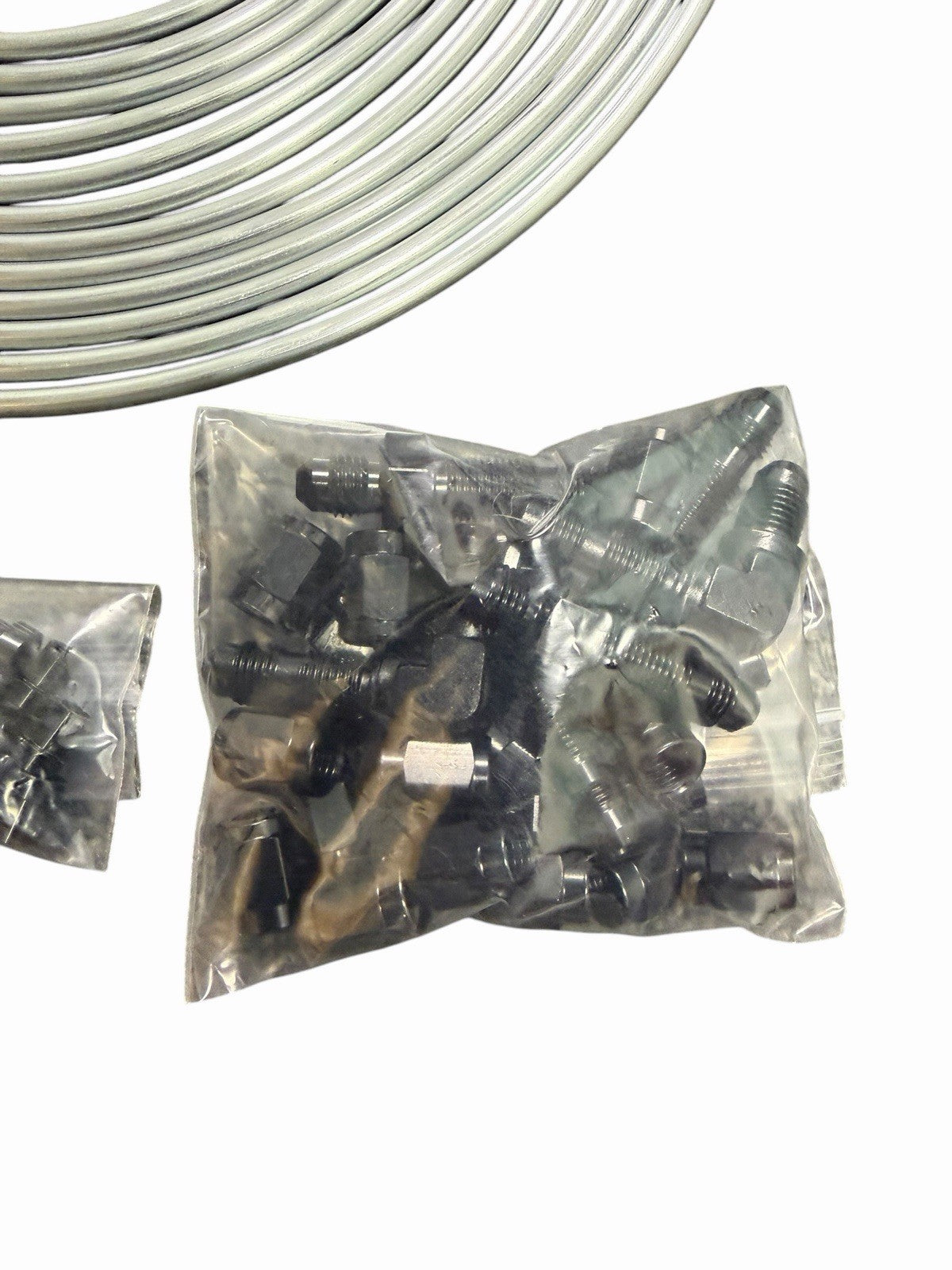 Stainless brake line tuck kit with banjo bolts for Honda Civic and Acura Integra, shown with brake lines and fittings by JackSpania Racing.