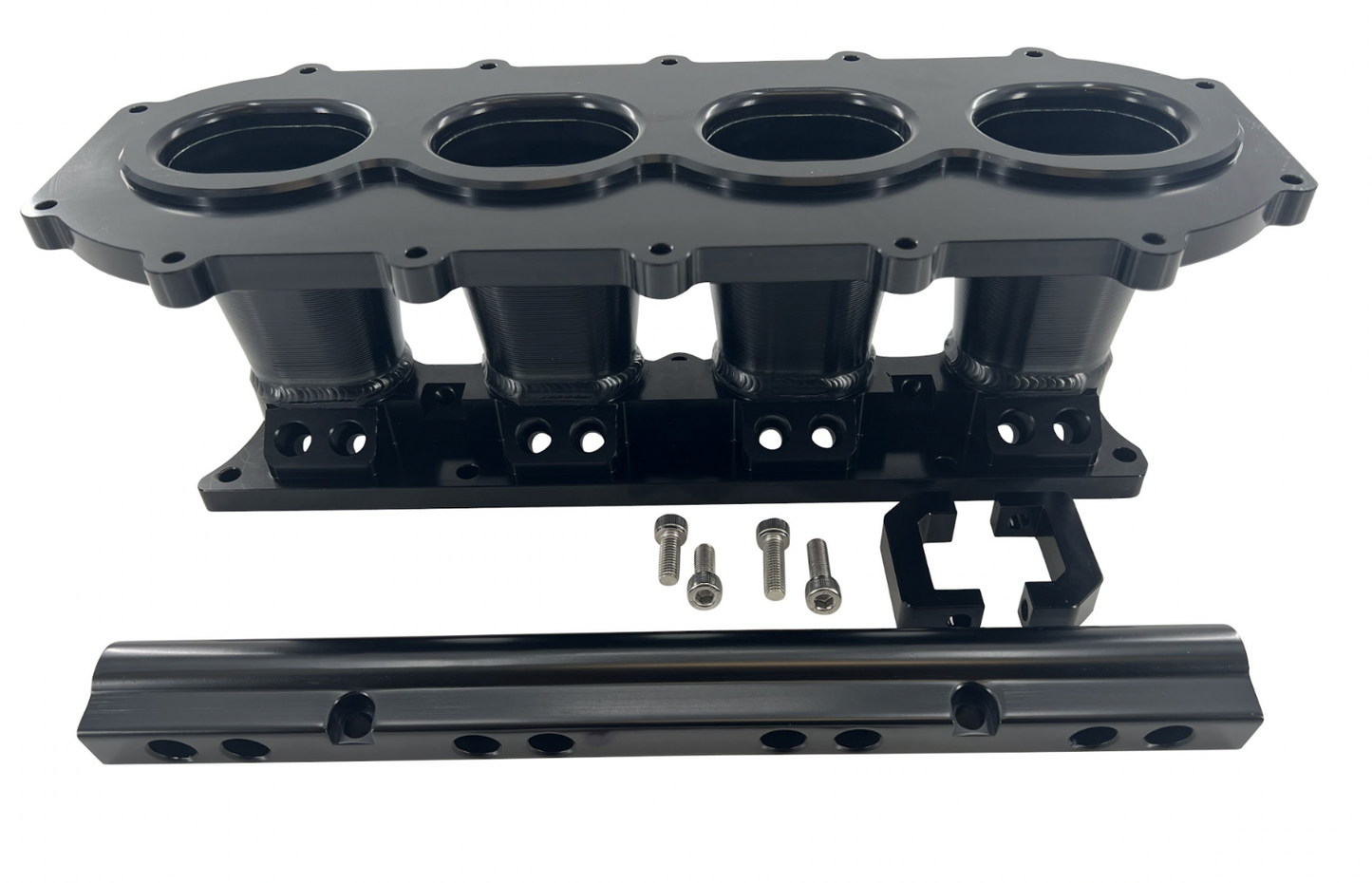 Jack Spania Racing billet K Series intake manifold adapter for Skunk2 Ultra engine parts, shown in a close-up image.