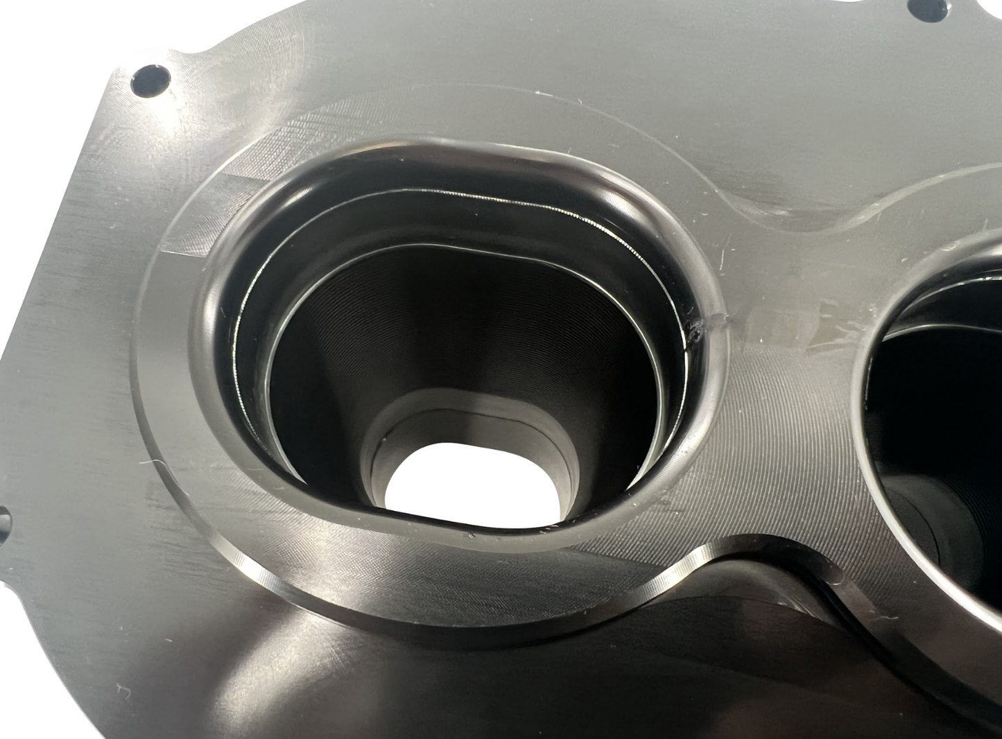 Jack Spania Racing billet K Series intake manifold adapter for Skunk2 Ultra engine parts, shown on a clean engine component.