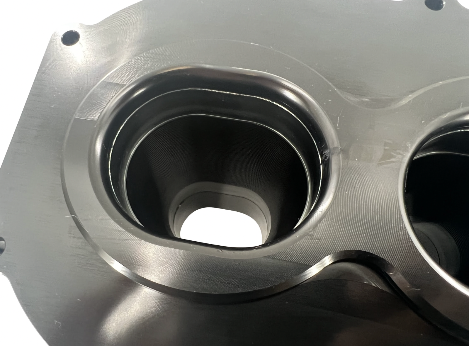 Jack Spania Racing billet K Series intake manifold adapter for Skunk2 Ultra engine parts, shown on a clean engine component.
