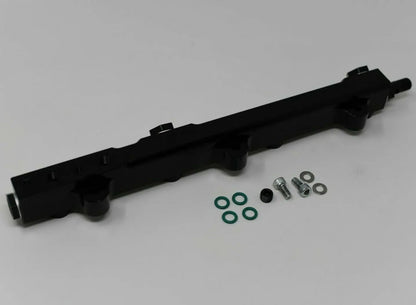 Jack Spania Racing high flow fuel rail for Honda Prelude H22 H23 and Accord F22 engine, showing the metal fuel rail with fittings.