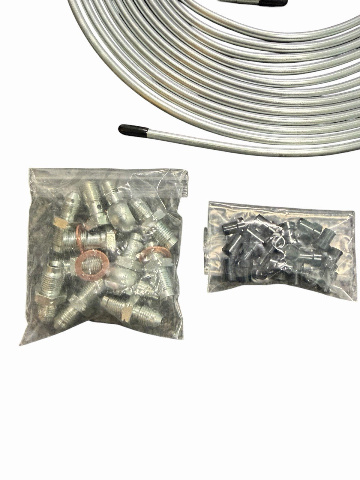Stainless brake line tuck kit with banjo bolts for Honda Civic and Acura Integra, installed on vehicle's brake system.