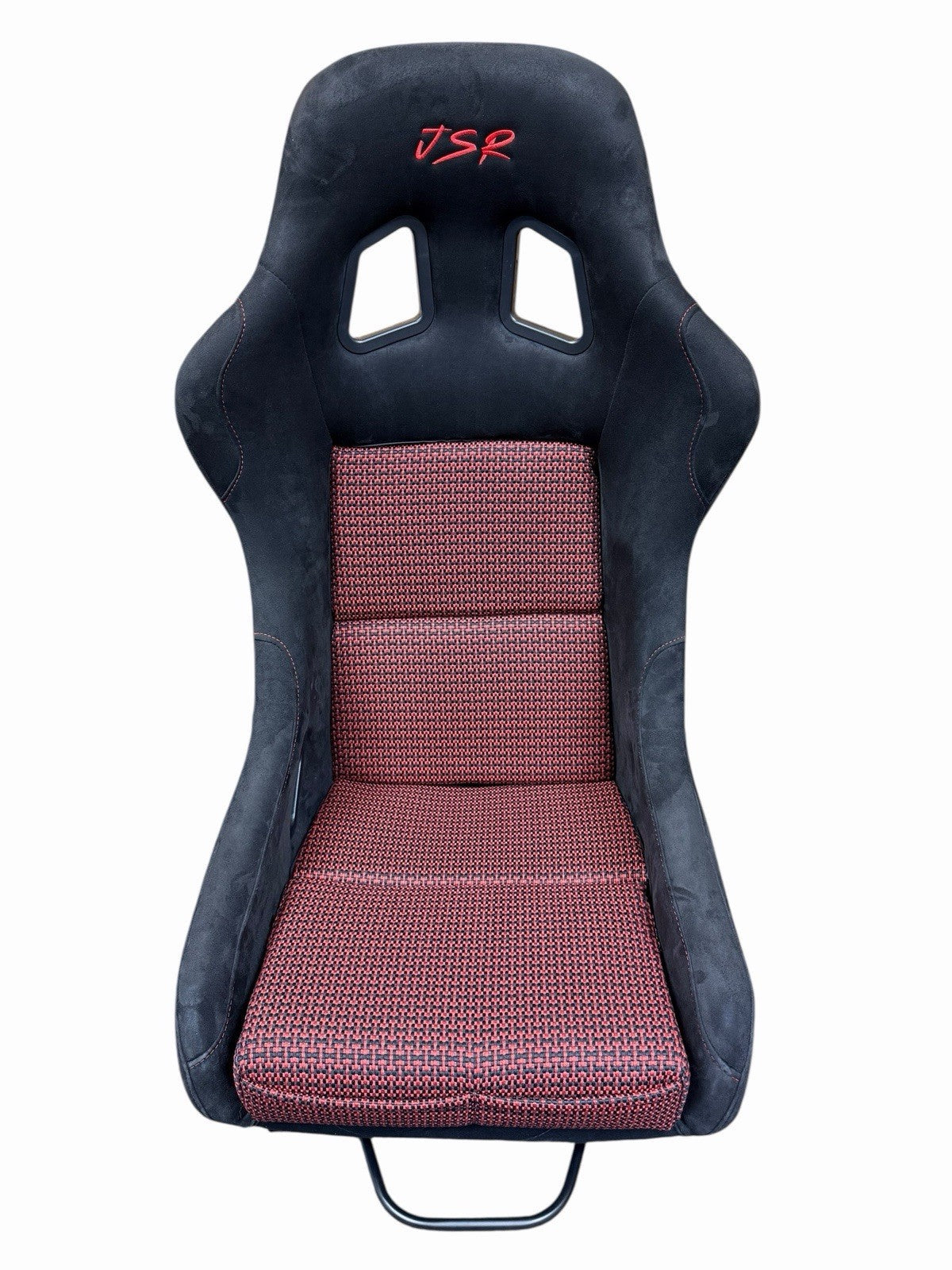 JackSpania Racing universal ultra lightweight fixed bucket seat with rails and sliders in suede, shown mounted inside a vehicle interior.