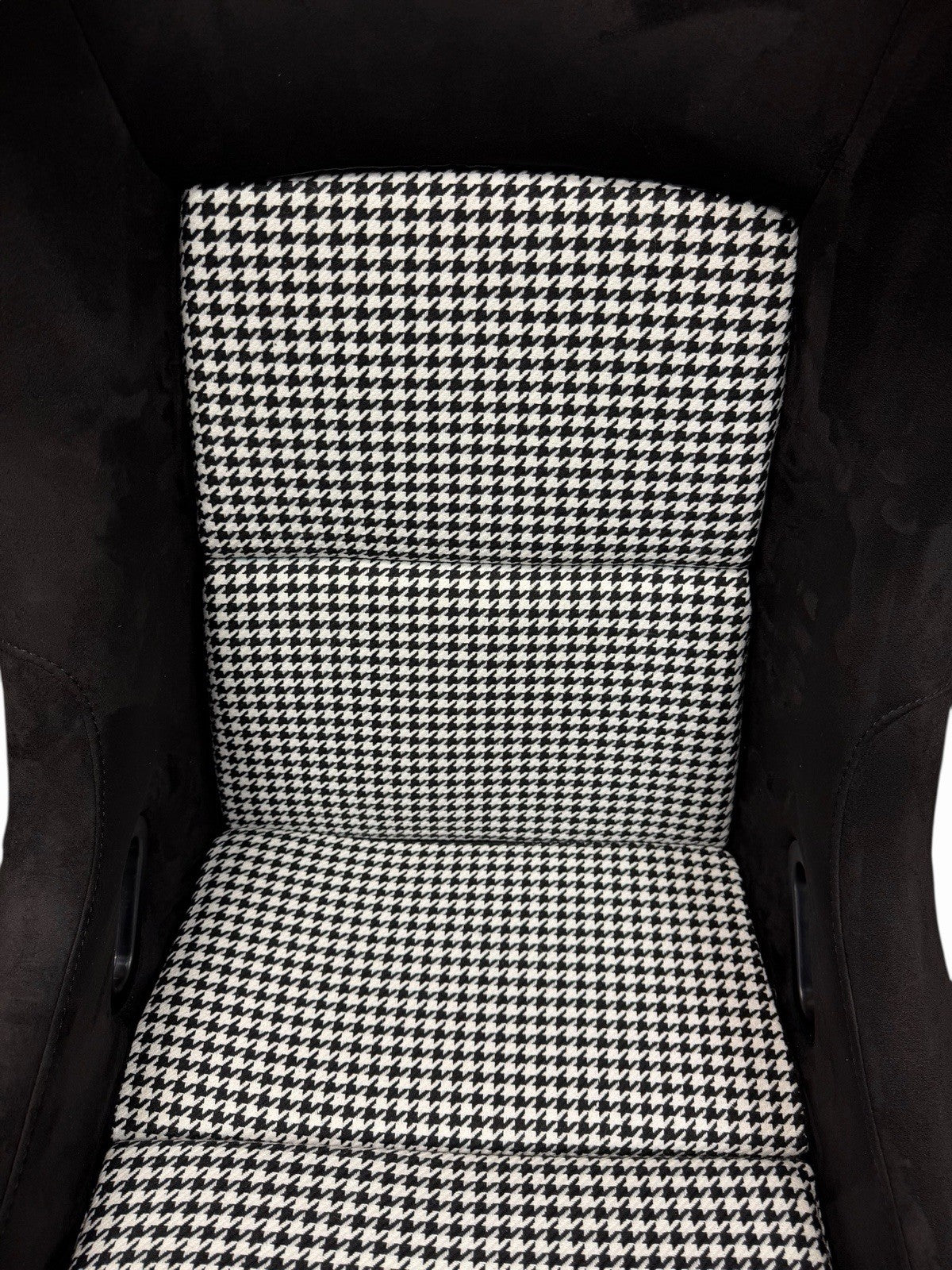 JackSpania Racing universal lightweight fixed bucket seat with suede upholstery, mounted with rails and sliders for interior racing use.