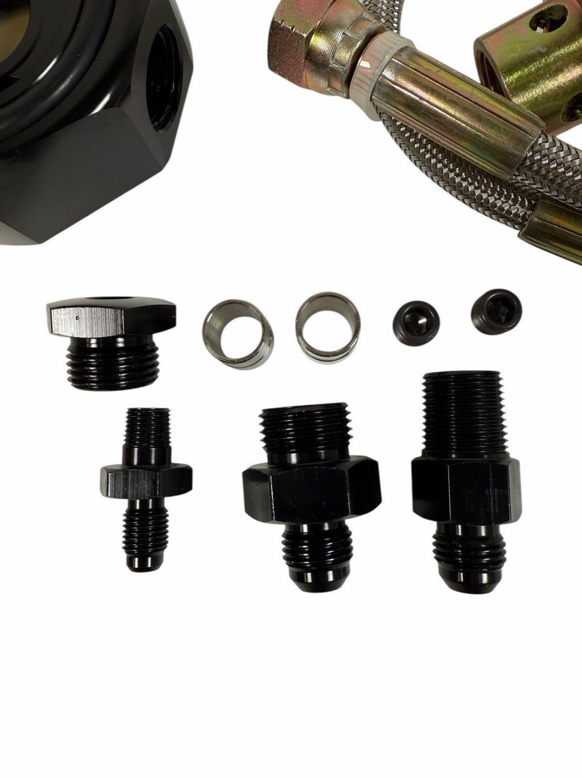 JackSpania Racing Honda Acura LS B20 oil supply line adapter plate for engine conversion, shown mounted on engine components.