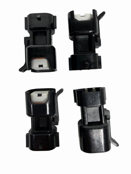 Set of 8 USCAR EV6 EV14 Denso-style fuel injector adapter connectors for engine compatibility, by JackSpania Racing.