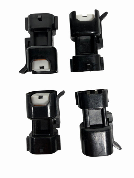 Set of 8 USCAR EV6 EV14 Denso-style fuel injector adapter connectors for engine compatibility, by JackSpania Racing.