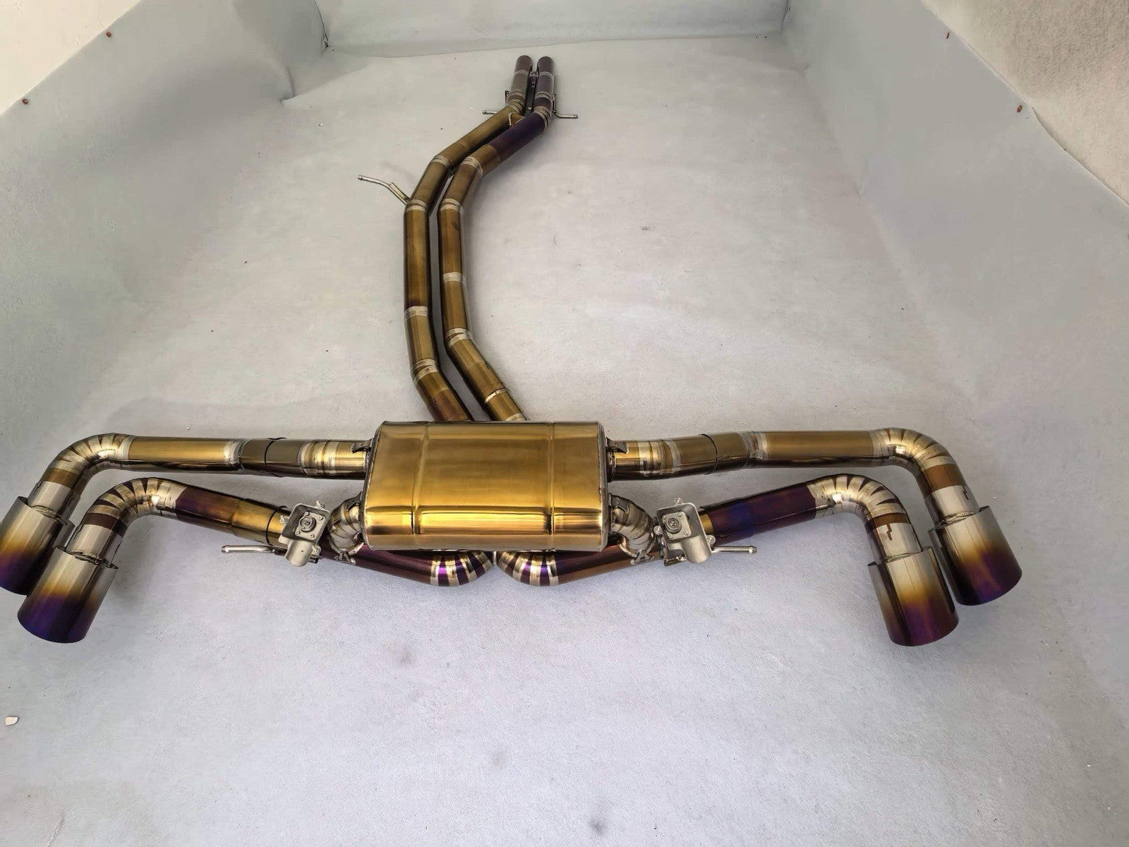 Titanium valved sport catback exhaust for 2018-2024 Lamborghini Urus by JackSpania Racing, showcasing sleek exhaust pipes and valves.
