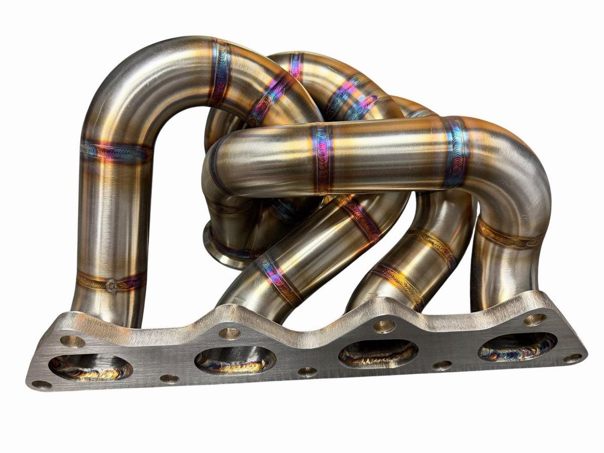 JackSpania Racing 316SS tubular turbo manifold with 44mm wastegate V-band for Evo 7 8 9 G4G63 engines, in polished stainless steel.