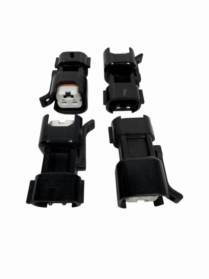 Set of 8 JackSpania Racing Denso style fuel injector adapters and connectors for EV6 and EV14 engine injectors.