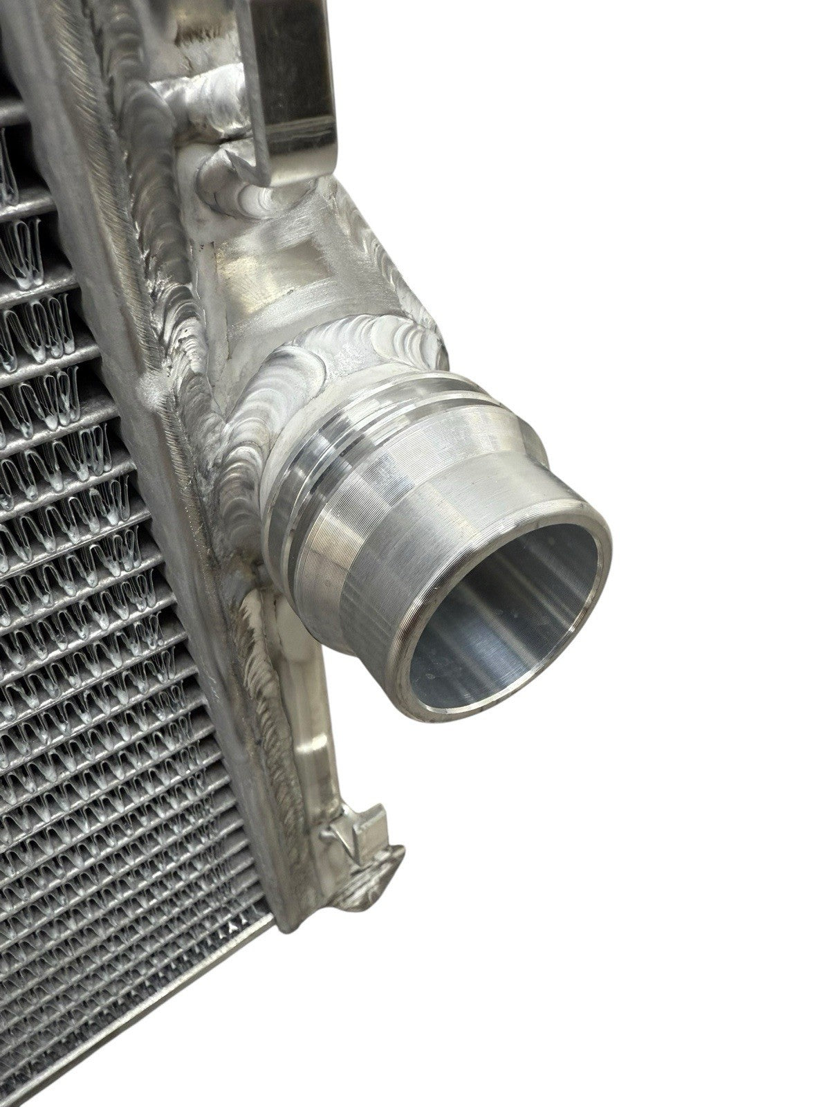 High performance JackSpania Racing heat exchanger radiator for BMW E46 3 Series M4 Z4 M52 M54 S54 engine parts, showing metal fins and fittings.