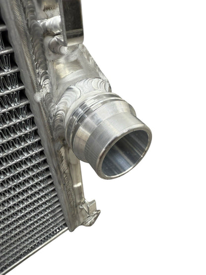 High performance JackSpania Racing heat exchanger radiator for BMW E46 3 Series M4 Z4 M52 M54 S54 engine parts, showing metal fins and fittings.