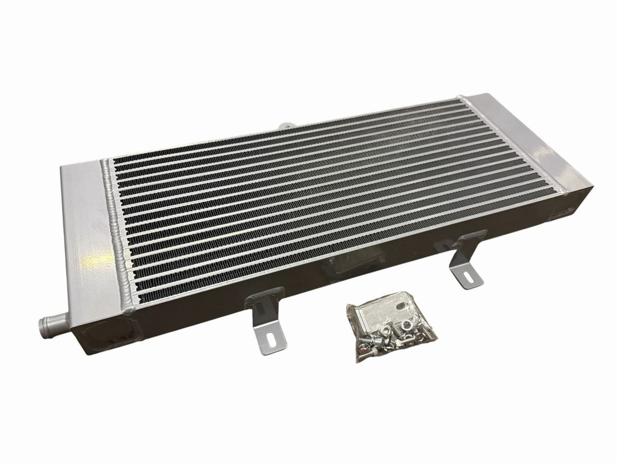 JackSpania Racing VR30 heat exchanger upgrade for Infiniti Q50 and Q60 3.0T Red Sport engine, showing the aluminum core and fittings.