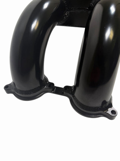 Rear-facing billet intake manifold for Subaru WRX STi 2004-2021 with 64mm throttle body, made by JackSpania Racing.