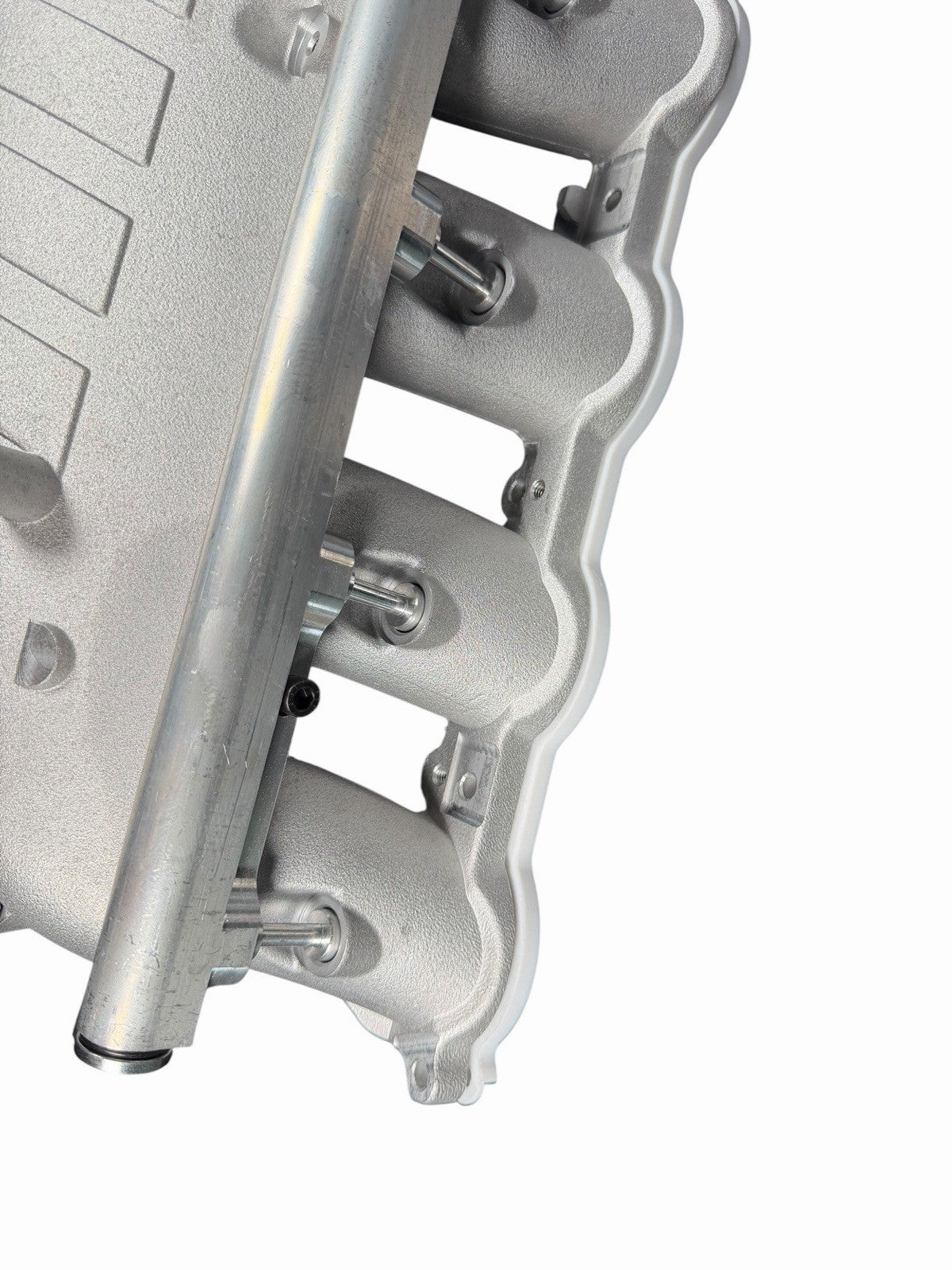 Cast aluminum charge cooler intake manifold for BMW G87 M2, G80 M3, G82 M4 S58 engine by JackSpania Racing, showing detailed engine part.