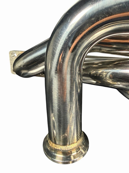 BMW E46 E36 E39 tubular top mount turbo manifold with T3/T4 flange and 44mm wastegate, by JackSpania Racing, in black finish.
