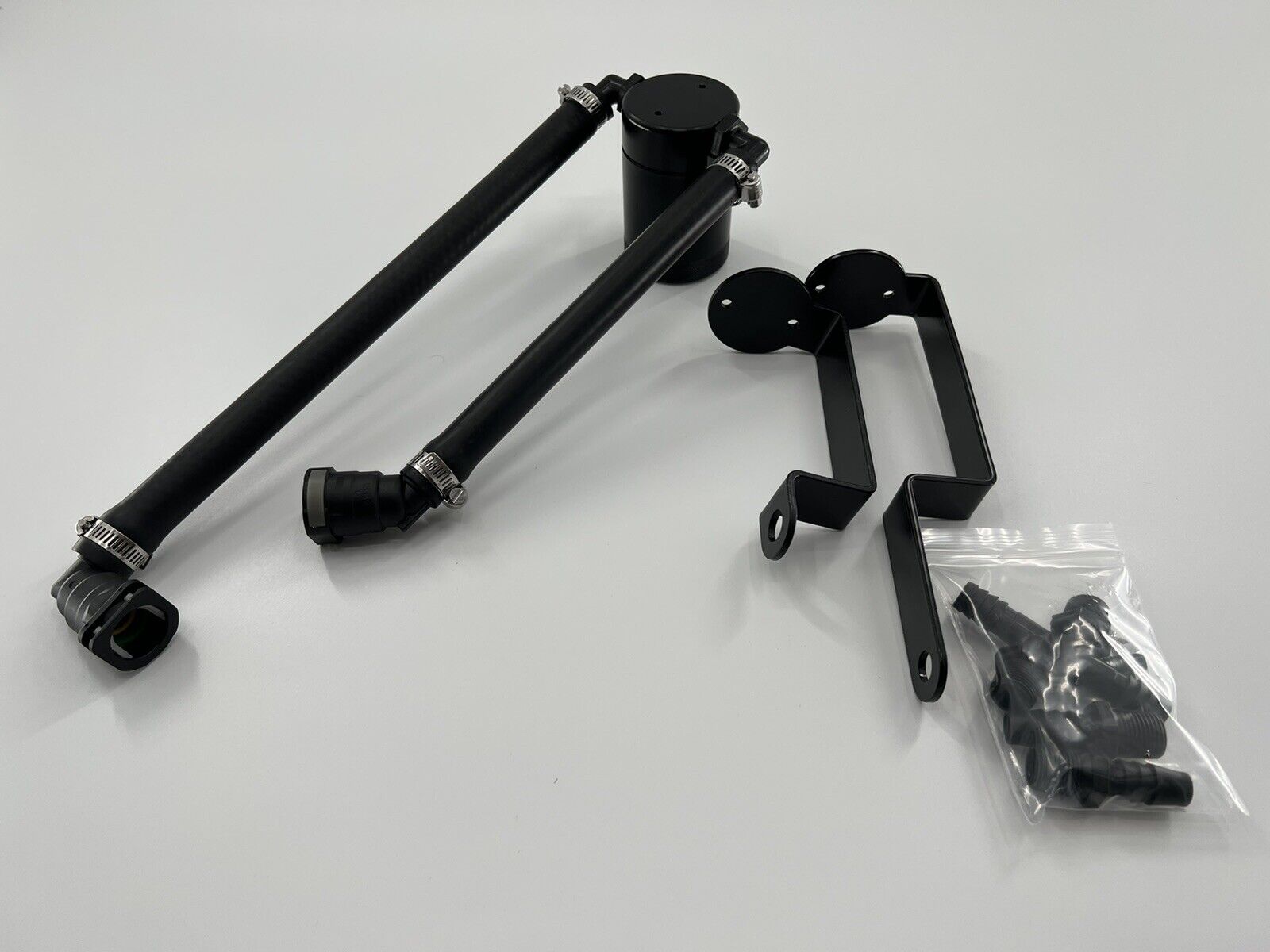 Jack Spania Racing oil separator catch can installed in a Dodge Durango Hellcat Trackhawk engine, showing the engine bay and catch can.