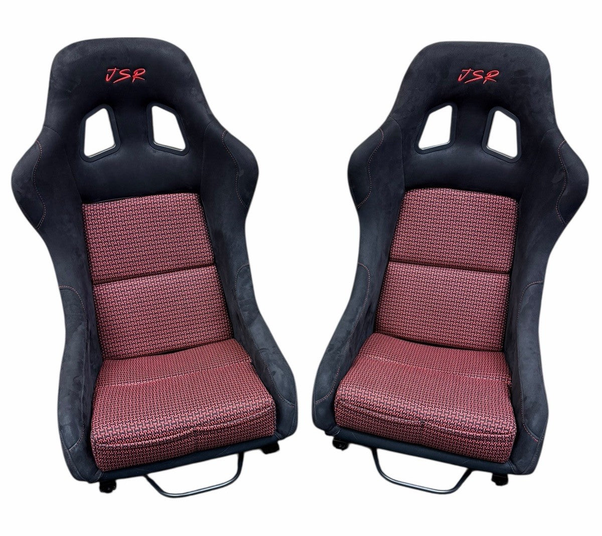 JackSpania Racing ultra lightweight fixed bucket seat with suede upholstery, mounted on rails with sliders for interior racing vehicle.