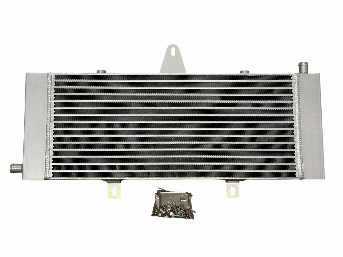 JackSpania Racing VR30 heat exchanger upgrade installed in Infiniti Q50 and Q60 3.0T engine, showcasing engine parts for improved cooling.