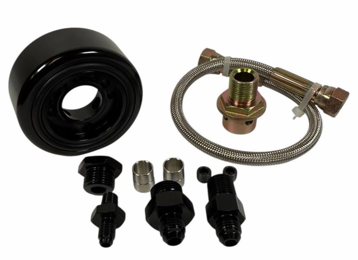 JackSpania Racing Honda Acura LS B20 oil supply line adapter plate for engine conversion, showing the metal component with mounting holes.